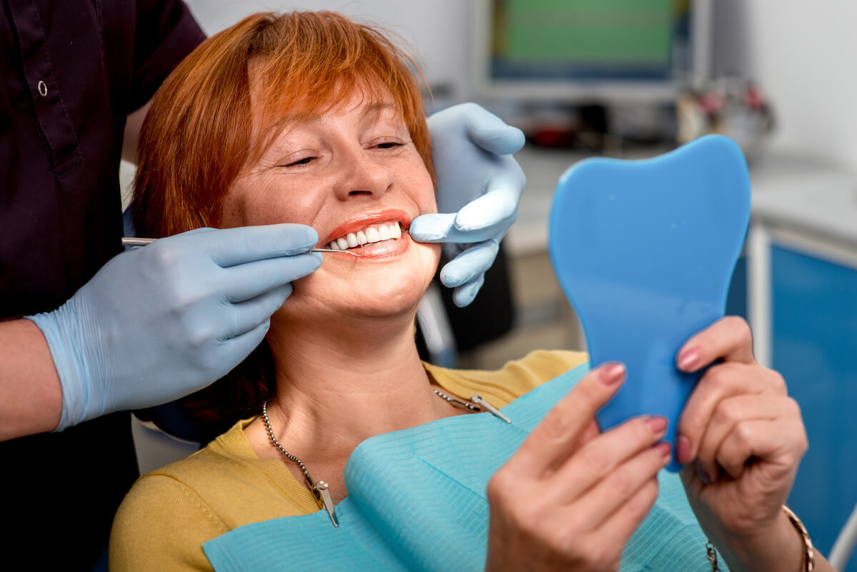 Woman smiling after dental treatment